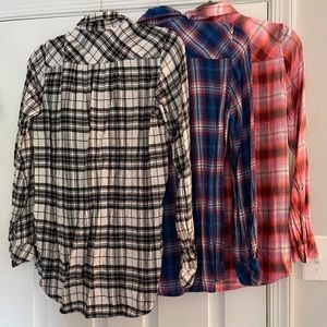 3 Gap flannel shirts size XS.  All in good condition.